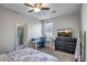 Cozy bedroom featuring a ceiling fan and a desk space for a functional design at 18662 W Foothill Dr, Surprise, AZ 85387