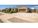 Charming single-Gathering home with a well-manicured lawn and an attached two-car garage at 18662 W Foothill Dr, Surprise, AZ 85387