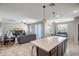 Inviting living space with tile floors, large windows, and stylish furniture for relaxing and entertaining at 18662 W Foothill Dr, Surprise, AZ 85387