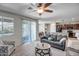 Bright and open living space with a view to the backyard, a kitchen island, and comfortable furnishings at 18662 W Foothill Dr, Surprise, AZ 85387