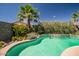 Inviting pool surrounded by lush landscaping, creating a private oasis at 18662 W Foothill Dr, Surprise, AZ 85387