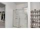 Shower stall with glass doors and a chrome shower head with tile surround at 18662 W Foothill Dr, Surprise, AZ 85387