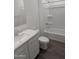Well-lit bathroom showcasing a sleek vanity, toilet, and a modern shower and bathtub at 18795 E Bruno Dr, Gold Canyon, AZ 85118