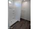 Modern bathroom featuring a stand-up shower with wooden-look floors and a neutral palette at 18795 E Bruno Dr, Gold Canyon, AZ 85118