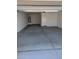 Spacious and clean two-car garage with white walls and concrete flooring; includes a convenient service door at 18795 E Bruno Dr, Gold Canyon, AZ 85118