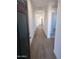 Inviting hallway features sleek wood-look tile flooring and leads to the home's open living spaces at 18795 E Bruno Dr, Gold Canyon, AZ 85118