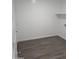 Functional laundry room with tile flooring, a built-in shelf, and a convenient door at 18795 E Bruno Dr, Gold Canyon, AZ 85118