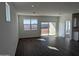 Bright living room featuring tile floors, recessed lighting, and sliding glass doors to the backyard at 18795 E Bruno Dr, Gold Canyon, AZ 85118