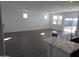 Bright living room with tile floors, recessed lights, and a sliding glass door to the backyard at 18795 E Bruno Dr, Gold Canyon, AZ 85118