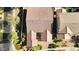Aerial perspective of home, highlighting the tile roof, manicured landscaping, and neighborhood at 19291 E Thornton Rd, Queen Creek, AZ 85142