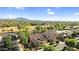 Tile roof homes in a desirable community with mature trees and mountain views in the distance at 19291 E Thornton Rd, Queen Creek, AZ 85142