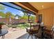 Relaxing backyard features manicured lawn and a covered patio at 19291 E Thornton Rd, Queen Creek, AZ 85142