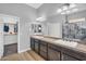 Bathroom with double sinks, framed mirror, and shower at 19291 E Thornton Rd, Queen Creek, AZ 85142