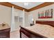 Bedroom with wood furniture, beige walls, and a ceiling fan at 19291 E Thornton Rd, Queen Creek, AZ 85142