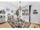 Cozy dining area features natural light, stylish furnishings, and wood-look flooring at 19291 E Thornton Rd, Queen Creek, AZ 85142
