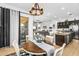Open concept dining area seamlessly connects to the kitchen and living spaces at 19291 E Thornton Rd, Queen Creek, AZ 85142