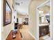 Inviting hallway leads to living spaces, featuring a charming view of a bathroom entrance at 19291 E Thornton Rd, Queen Creek, AZ 85142