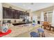 Spacious kitchen features granite countertops, dark wood cabinetry, and stainless steel appliances at 19291 E Thornton Rd, Queen Creek, AZ 85142