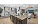 The spacious kitchen features a large center island, stainless steel appliances, and an open layout at 19291 E Thornton Rd, Queen Creek, AZ 85142