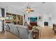 Cozy living room with a sliding glass door providing natural light and access to the outdoor space at 19291 E Thornton Rd, Queen Creek, AZ 85142