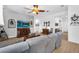 Well-lit living room featuring modern furnishings and an open layout, creating a welcoming space at 19291 E Thornton Rd, Queen Creek, AZ 85142