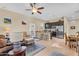 Combined living and kitchen space offers granite countertops, stainless appliances, with a cozy seating area at 19291 E Thornton Rd, Queen Creek, AZ 85142