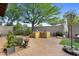 Backyard features a built-in outdoor kitchen with a stainless steel grill and patio at 19291 E Thornton Rd, Queen Creek, AZ 85142