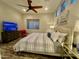 Comfortable bedroom featuring a ceiling fan, neutral decor, and ample natural light at 2042 W Periwinkle Way, Chandler, AZ 85248