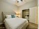 Bedroom featuring a comfortable bed, ceiling fan, and a walk-in closet at 2042 W Periwinkle Way, Chandler, AZ 85248