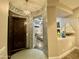 Arched entry to foyer with decorative mosaic tile and statement lighting. Open layout into living space at 2042 W Periwinkle Way, Chandler, AZ 85248