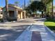 Community gated entrance and guardhouse featuring block paved entrance, mature landscaping and architecture at 2042 W Periwinkle Way, Chandler, AZ 85248
