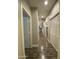 Hallway with wood floors, neutral paint, and easy access to other rooms at 2042 W Periwinkle Way, Chandler, AZ 85248