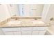 Bathroom features a double sink vanity with granite countertops and modern fixtures at 20435 W Mountain Sage Dr, Buckeye, AZ 85326