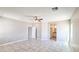 Large bedroom with tile flooring leads to the bathroom and walk-in closet at 20435 W Mountain Sage Dr, Buckeye, AZ 85326