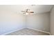 Neutral bedroom with tile flooring and ceiling fan, perfect for relaxation and comfort at 20435 W Mountain Sage Dr, Buckeye, AZ 85326