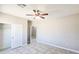 Bright bedroom featuring tile flooring, closet, and neutral tones to create a calming space at 20435 W Mountain Sage Dr, Buckeye, AZ 85326