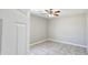 Simple bedroom with tile flooring, a ceiling fan, and neutral walls for customizable decor at 20435 W Mountain Sage Dr, Buckeye, AZ 85326