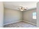 Cozy bedroom features tile flooring, neutral walls and a ceiling fan with lighting at 20435 W Mountain Sage Dr, Buckeye, AZ 85326