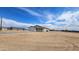 A new single-story home with an attached garage and desert landscape, part of a developing residential community at 20435 W Mountain Sage Dr, Buckeye, AZ 85326