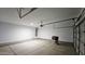 Bright and clean garage featuring overhead lighting and plenty of space at 20435 W Mountain Sage Dr, Buckeye, AZ 85326