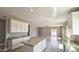 A spacious open-concept kitchen boasts granite countertops, an island, and tiled floors at 20435 W Mountain Sage Dr, Buckeye, AZ 85326