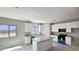 Well-lit kitchen featuring an island, granite countertops, and stainless steel appliances at 20435 W Mountain Sage Dr, Buckeye, AZ 85326