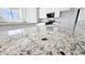 Beautiful kitchen island with granite countertops and modern cabinetry is a chef's dream at 20435 W Mountain Sage Dr, Buckeye, AZ 85326