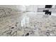 Gleaming granite kitchen island reflecting light adds elegance and style to this modern home at 20435 W Mountain Sage Dr, Buckeye, AZ 85326