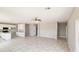 A spacious living room that is part of an open-concept design with tile flooring at 20435 W Mountain Sage Dr, Buckeye, AZ 85326