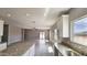 The kitchen features an island and is open to the living room providing an inclusive space at 20435 W Mountain Sage Dr, Buckeye, AZ 85326
