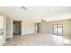 The open-concept living room showcases tile floors, recessed lighting, and a sliding glass door at 20435 W Mountain Sage Dr, Buckeye, AZ 85326