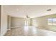 A bright living room boasts tile floors, recessed lighting and scenic outdoor views at 20435 W Mountain Sage Dr, Buckeye, AZ 85326