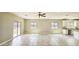 A bright living room with scenic outdoor views, tile flooring, and recessed lighting at 20435 W Mountain Sage Dr, Buckeye, AZ 85326