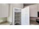 A bright, walk-in pantry featuring ample shelving for organized storage in the kitchen at 20435 W Mountain Sage Dr, Buckeye, AZ 85326